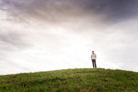 man standing in field