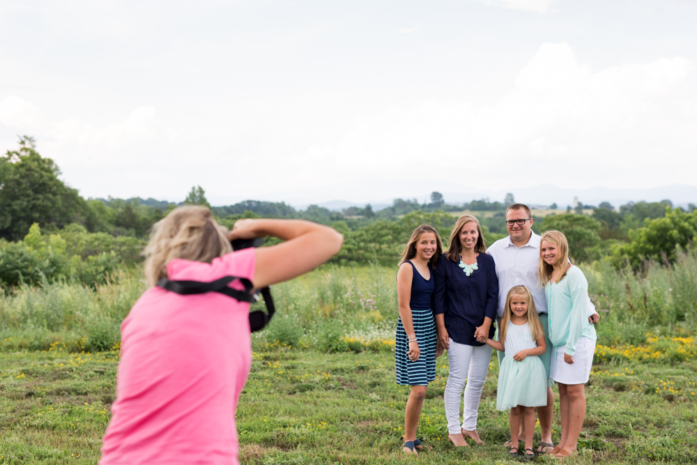 kristy dooley photographing family in field