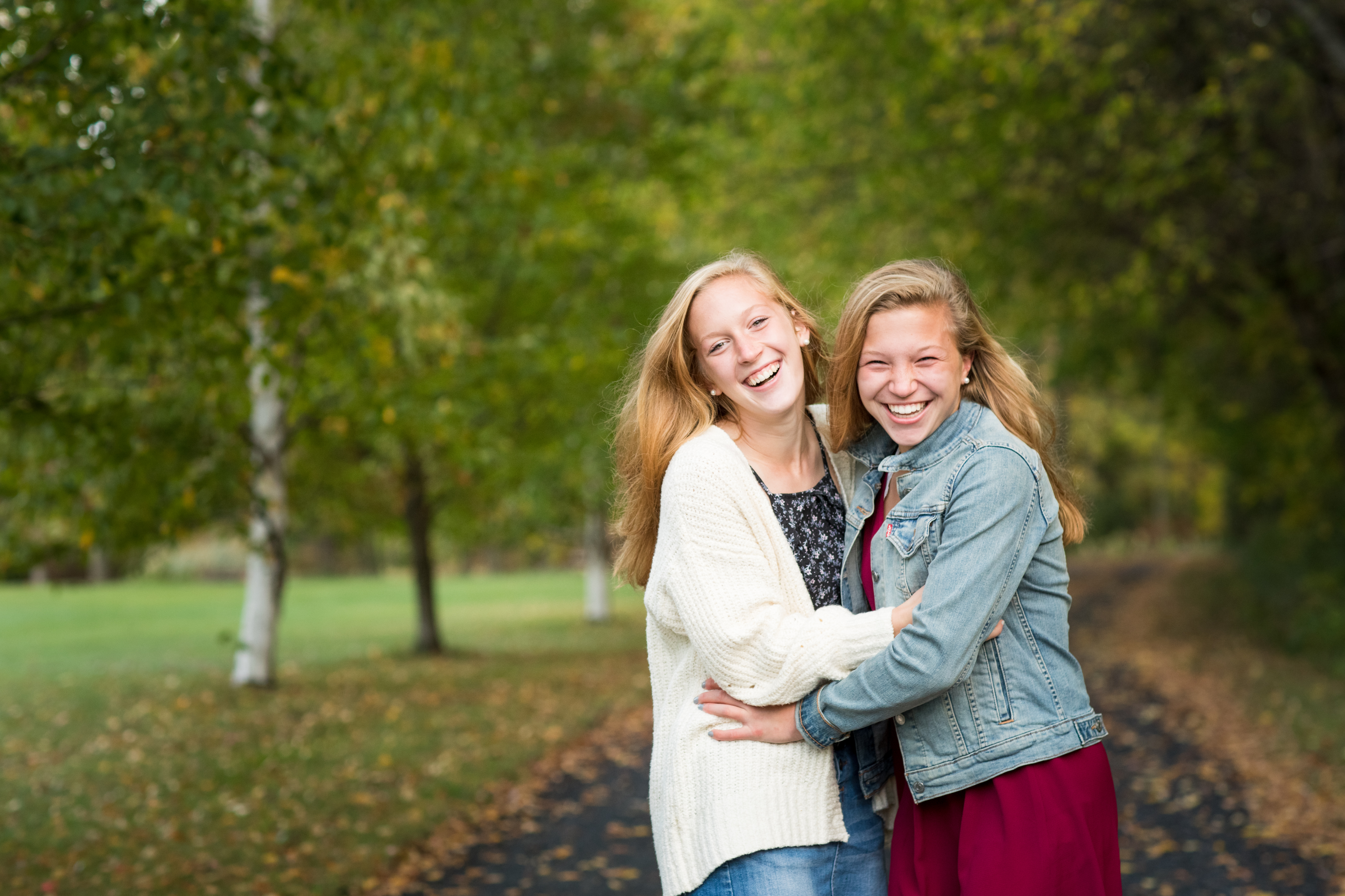 two girls smiling fall in vermont