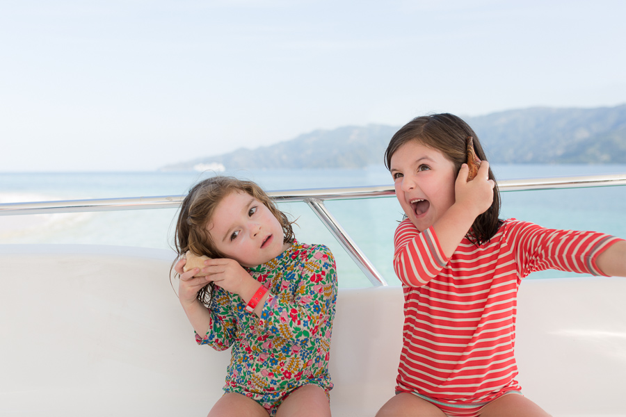 children smiling on boat photography
