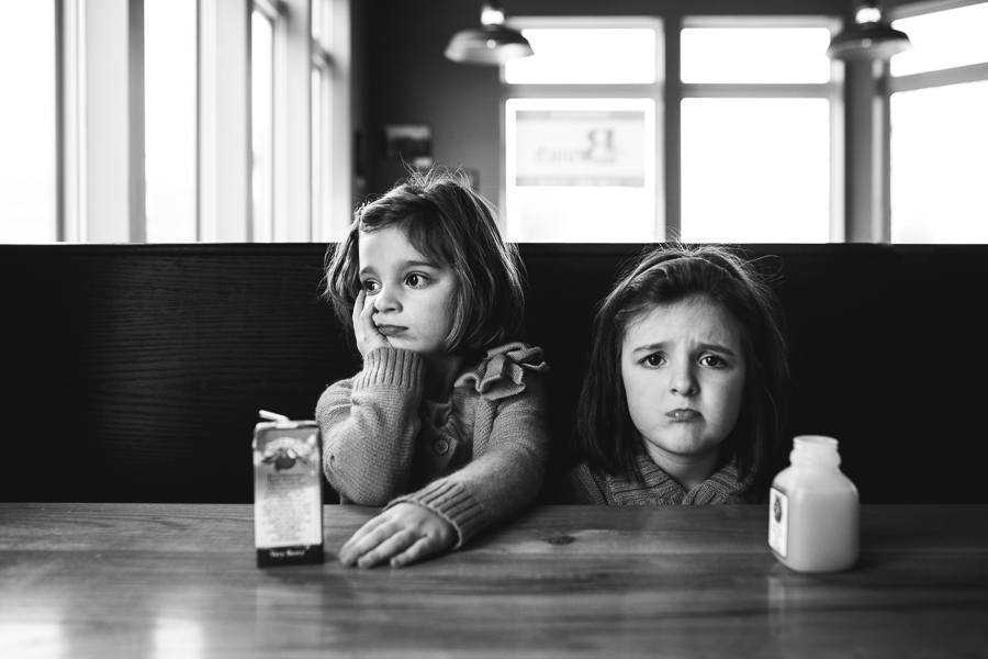 kids at restaurant black and white