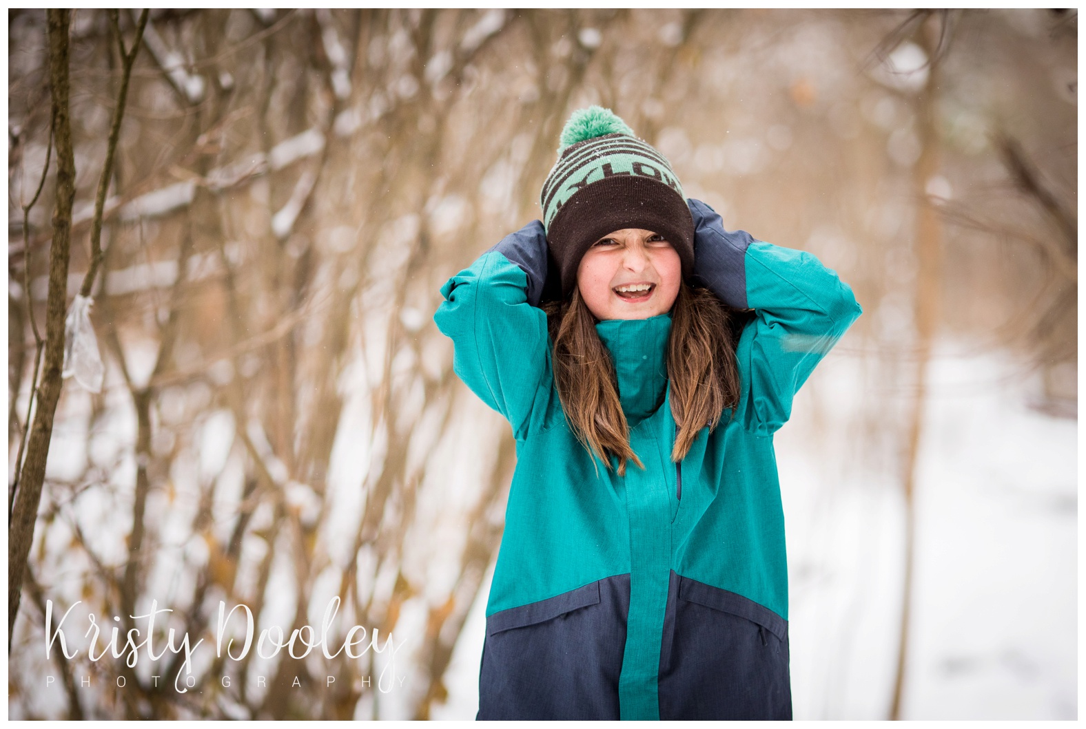 girl smiling in the snow