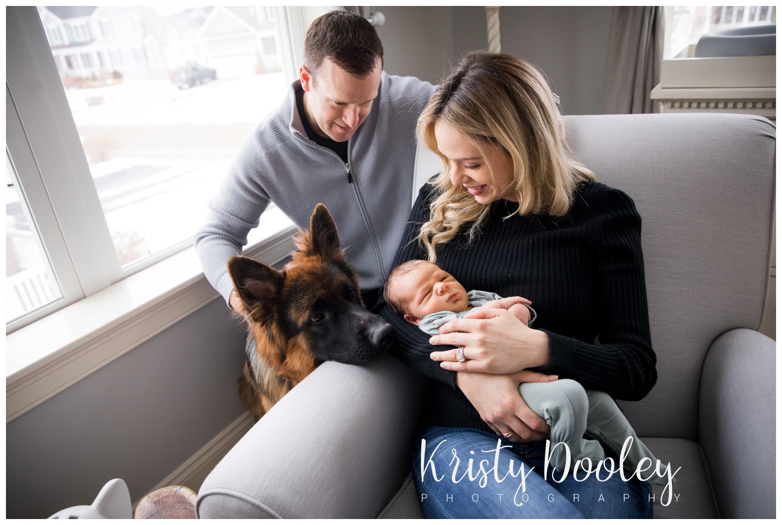 newborn photography with parents and dog